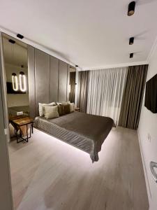 Katil atau katil-katil dalam bilik di Hils Hotel Apartment by Warm