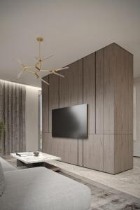 un soggiorno con una TV a parete di Dukley Villa sea view a Budua