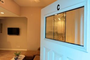 a sliding door with a window in a living room at 359SC 359 Sumner C in Avalon