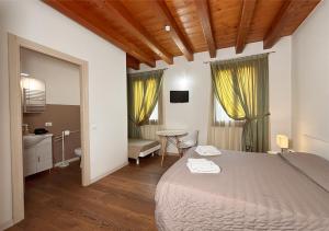 A bed or beds in a room at Agriturismo Vecio Portico