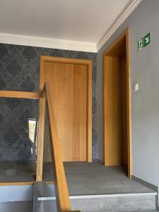 Postel nebo postele na pokoji v ubytování Gryfny Hotel
