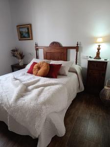 a bedroom with a bed with a pumpkin on it at Casa Rural Gafas in El Toboso