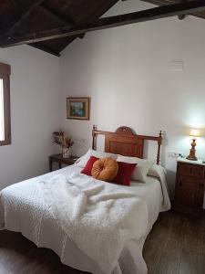 a bedroom with a bed with a pumpkin on it at Casa Rural Gafas in El Toboso