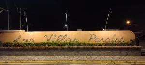 a retaining wall with graffiti on it at night at Villa Coco - Jaco Beach in Jacó +25 photos