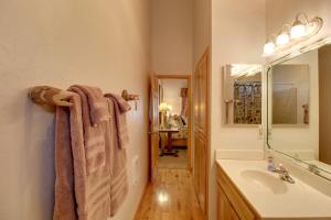 a bathroom with a sink and a mirror at Scenic Deck and Horse Corral Pinetop-Lakeside Cabin in Pinetop-Lakeside +29 photos