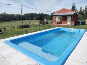 Bazén v ubytování Cabaña La Retama nebo v jeho okolí