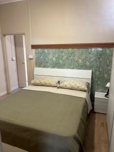 Postel nebo postele na pokoji v ubytování Appartamenti Minturnae Relais