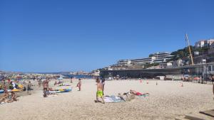 a group of people on the beach at a beach at Studio Proche Plage du Prophète in Marseille