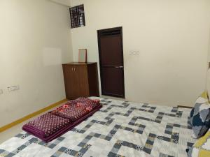 Letto o letti in una camera di Shree Dev Kripa Geust house