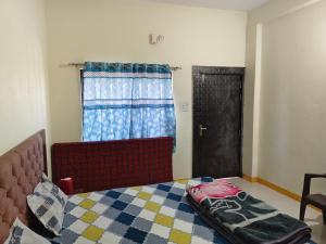 Letto o letti in una camera di Shree Dev Kripa Geust house