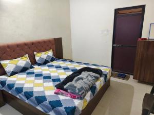Letto o letti in una camera di Shree Dev Kripa Geust house