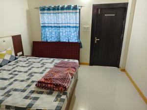 Letto o letti in una camera di Shree Dev Kripa Geust house