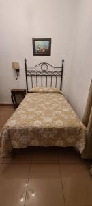 Postel nebo postele na pokoji v ubytování Hostal Trajano + 7 fotografií