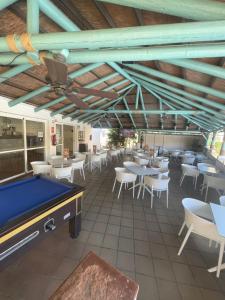a pool table in a restaurant with tables and chairs at Vox Maris by Wyndham Costa del Sol in Fuengirola