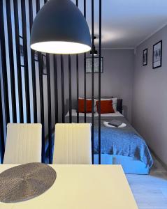Postel nebo postele na pokoji v ubytování Apartament Dzikowiec