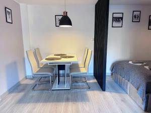 Postel nebo postele na pokoji v ubytování Apartament Dzikowiec