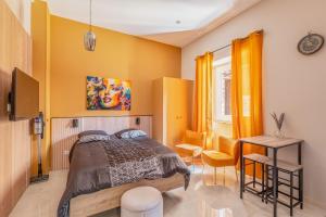 a bedroom with a bed and a table at Vienne in Lyon