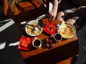 a table with three plates of food on it at Pondok Salacca#bamboohouse# in Candidasa