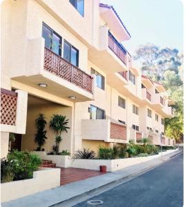 an apartment building with balconies on a street at Bahia Vista C53 in Avalon