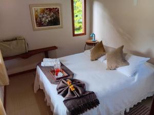 Cama ou camas em um quarto em Pousada Maritacas do Sana
