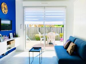 Posezení v ubytování Studio La Fontaine cosy et climatisé 2 personnes