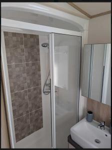 a bathroom with a shower and a sink at Holiday Home Retreat, Sleeps 6 in Saint Leonards