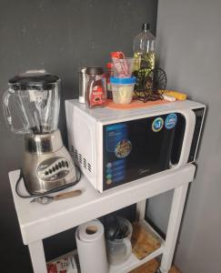 a microwave on a shelf with a blender on it at Departamento 2 a 200 mts de Imss 25 in Monterrey