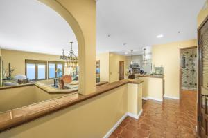 a kitchen and living room with an archway at H153 - Hamilton Cove Villa 1-53 in Avalon