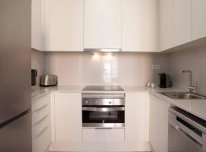 Kuchyňa alebo kuchynka v ubytovaní APBCN Eixample Center