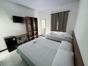 Postel nebo postele na pokoji v ubytování Hotel GAB RESIDENCIAL
