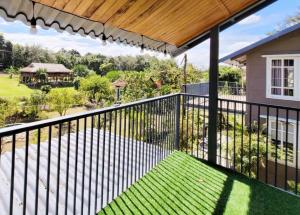 a balcony with a view of a yard at Suoirao Chau Duc Green Retreat in Ấp Quảng Giáo