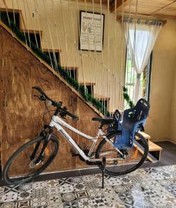 a bike parked in a room next to a staircase at Suoirao Chau Duc Green Retreat in Ấp Quảng Giáo
