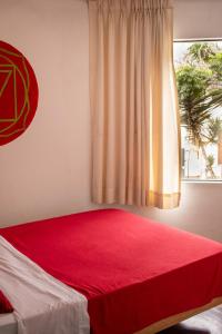 Ένα ή περισσότερα κρεβάτια σε δωμάτιο στο Temazcal Hostel