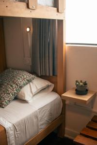 Ένα ή περισσότερα κρεβάτια σε δωμάτιο στο Temazcal Hostel