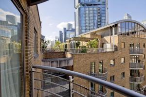 a balcony with a view of the city at Imperial Meridian Place Apartment in London