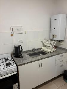 Køkken eller tekøkken på Depto Costanera + 2 billeder