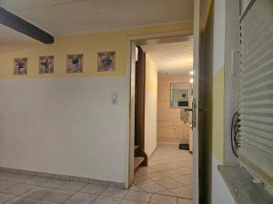 a hallway of a house with a door open at Fewo-O3-4-6-Personen-23km-bis-Frankfurt-Nord in Ober-Mörlen +4 photos
