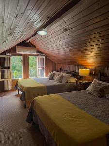 Postel nebo postele na pokoji v ubytování HMG Morada & Chalet - Centro histórico