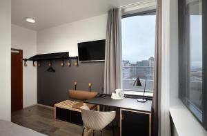 Телевизор и/или развлекательный центр в Hotel Cabin