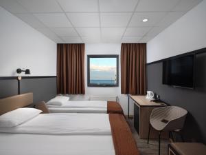 Кровать или кровати в номере Hotel Cabin