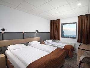 Кровать или кровати в номере Hotel Cabin