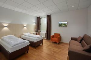 Postel nebo postele na pokoji v ubytování Hotel Klettur