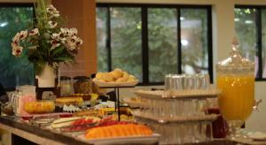 a buffet of food and drinks on a table at Smart Cataratas Hotel in Foz do Iguaçu
