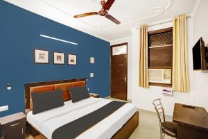 Postel nebo postele na pokoji v ubytování Super Collection O Agniv Residency Near Saket Metro