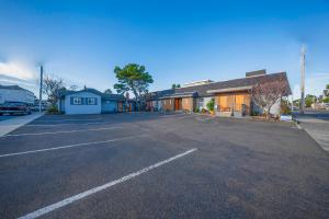 an empty parking lot in front of a building at City Centre Motel by OYO in Seaside