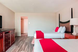 Postel nebo postele na pokoji v ubytování OYO Hotel Alice TX Hwy 281 West