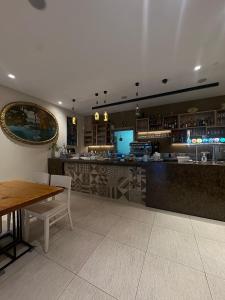 A restaurant or other place to eat at *Veranda's rooms* - Free parking in central Lugano