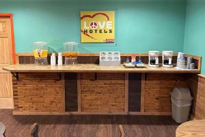 a counter in a restaurant with a love motel sign at Love Hotels Kadoka by OYO at Badlands SD in Kadoka