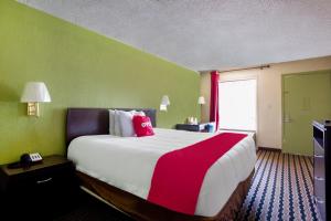 Voodi või voodid majutusasutuse OYO Hotel Pensacola I-10 & Hwy 29 toas