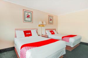 Postel nebo postele na pokoji v ubytování OYO Hotel Durham West Hills